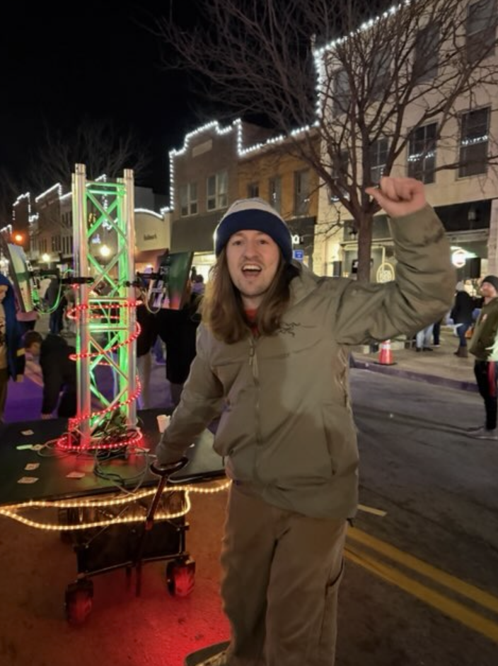 Team member celebrating at Living Windows 2025 gaming event downtown Jefferson City