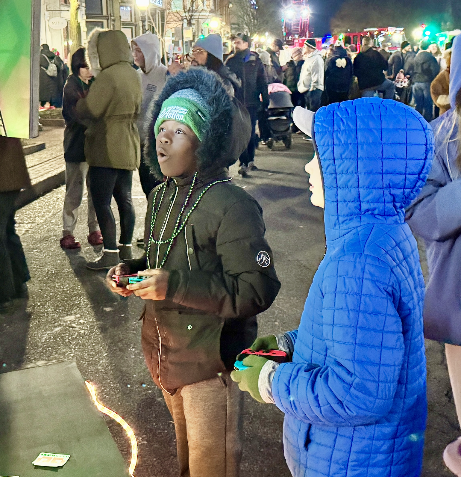 Kids gaming on portable Switch setup at Jefferson City Living Windows 2025 holiday event
