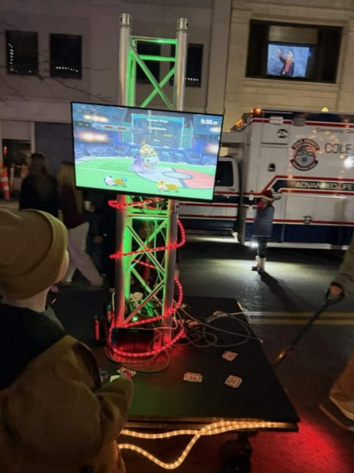 Gamers playing Nintendo Switch games on portable gaming setup at Living Windows Jefferson City 2025